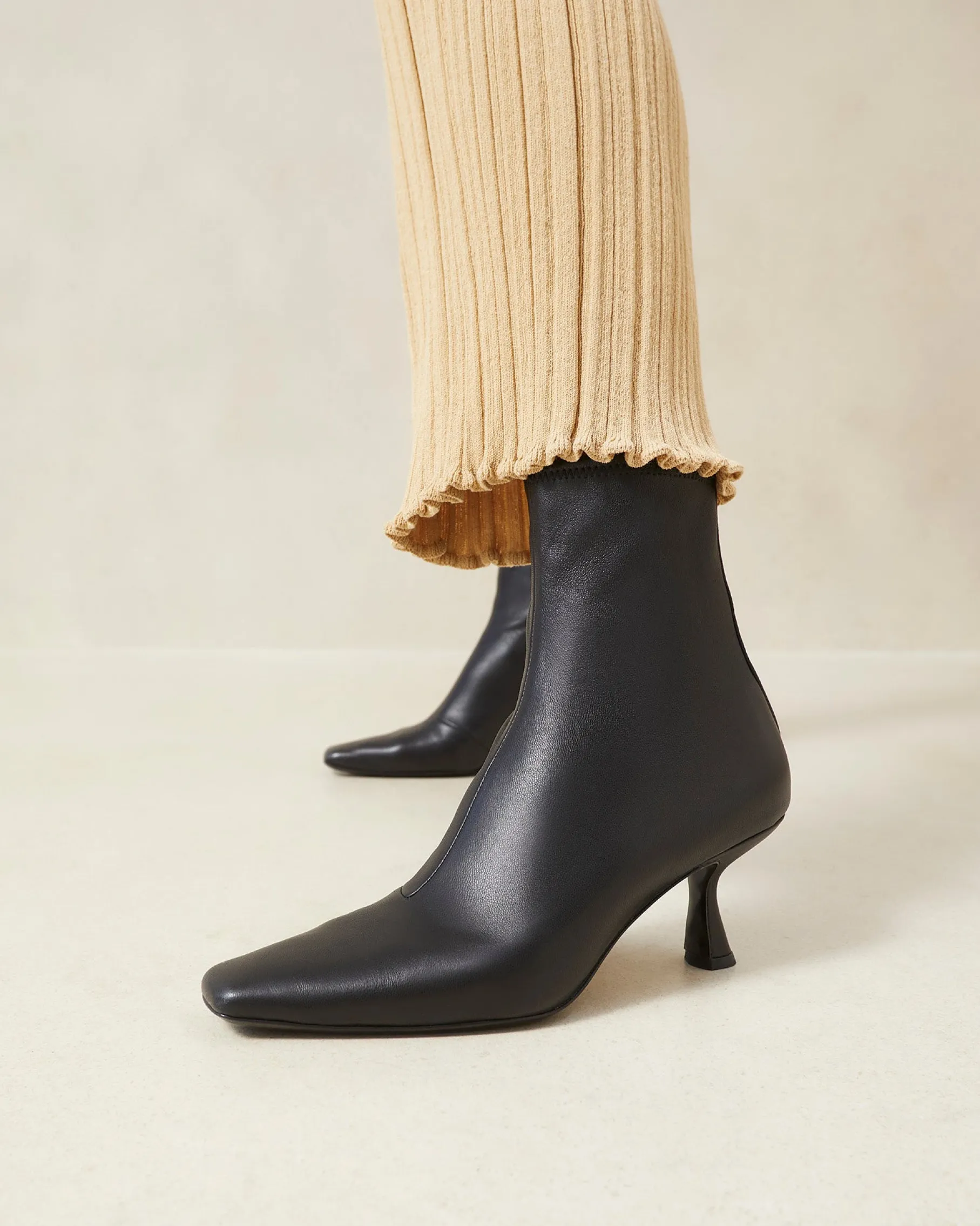 Thandy Black Curved Heel Bootie